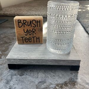 Bathroom set; sign and toothbrush holder